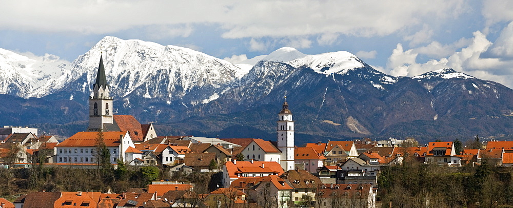 St. Cantianus Church in the foreground and the Kamnik Alps behind, Kranj, Slovenia, Europe