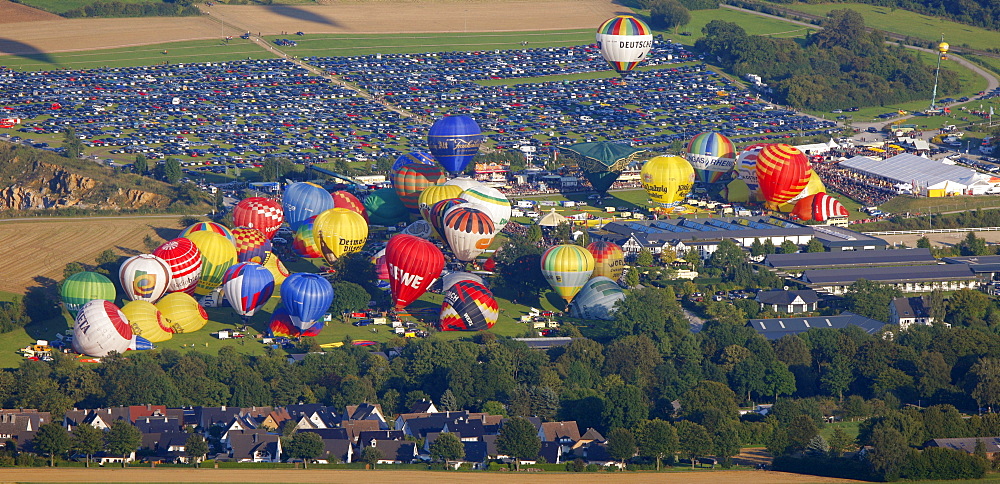 Aerial view, 20th Warsteiner Montgolfiade, hot air balloon festival with nearly 200 hot air balloons ascending into the sky, Warstein, Sauerland, North Rhine-Westphalia, Germany, Europe