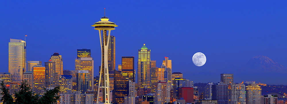 Panoramic night scene, skyline of the Financial District in Seattle with a full moon, Space Needle, Columbia Center, formerly known as Bank of America Tower, Washington Mutual Tower, Municipal Tower, formerly Key Tower, U.S. Bank Center, Washington, Unite