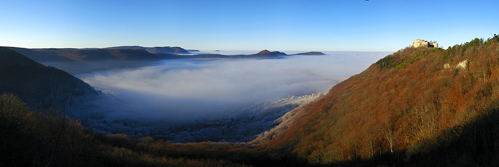 Burg Hohenneuffen Castle above a fog-filled valley, Swabian Alb, Baden-Wuerttemberg, Germany, Europe