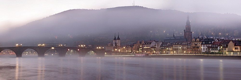 Heidelberg on the Neckar river with Karl-Theodor-Bruecke bridge, and the old town on a misty autumn morning, Baden-Wuerttemberg, Germany, Europe