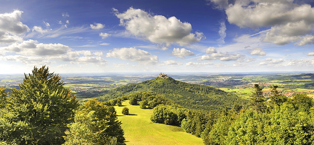 View over the Zellerhornwiese pasture on Burg Hohenzollern castle from Mt. Zeller Horn, Zollernalbkreis county, Baden-Wuerttemberg, Germany, Europe