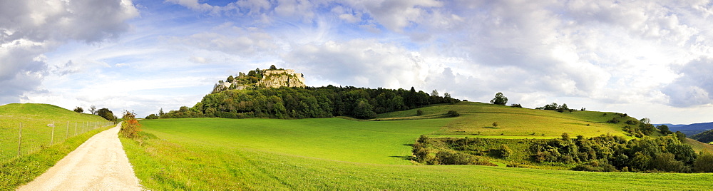 Panoramic view towards the fortress ruins of Hohentwiel, an extinct volcano in the Hegau region, district of Konstanz, Baden-Wuerttemberg, Germany, Europe