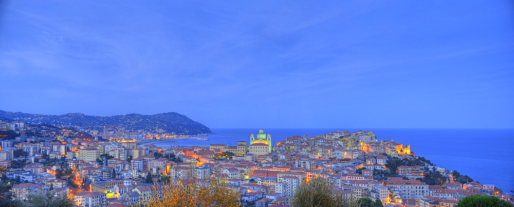 Panorama exposure, night exposure of Imperia, Oneglia and Porto Maurizio districts with classical cathedral, Riviera dei Fiori, Liguria, Italy, Europe