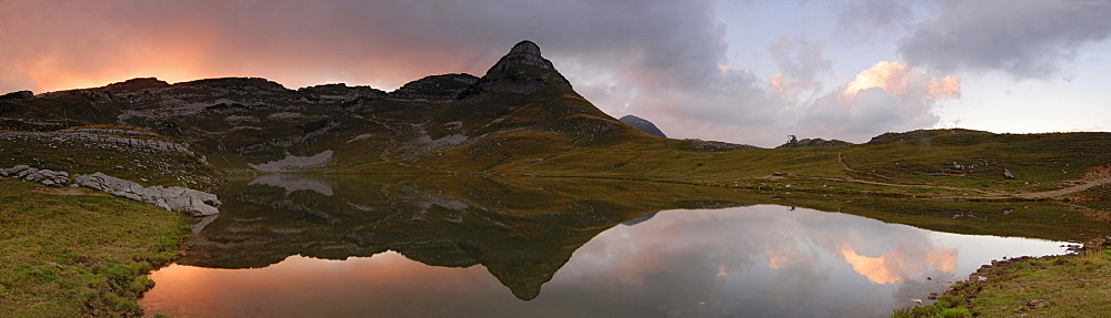 Mt. Loser reflected in a small pond at sunset, Styria, Austria, Europe