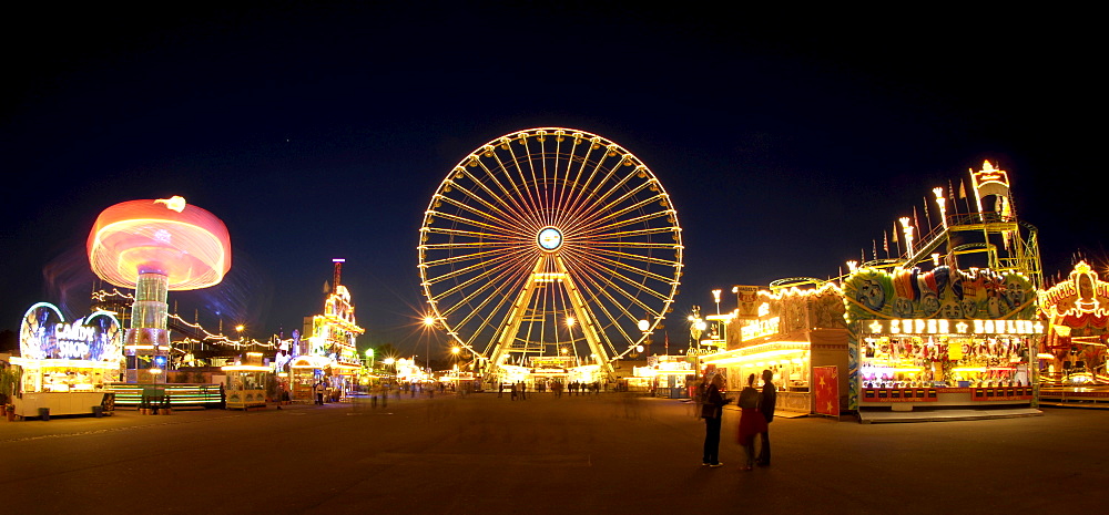 Fun fair with chairoplane and Ferris wheel