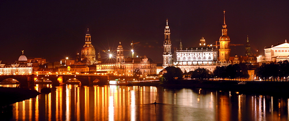 World cultural heritage DRESDEN at the River Elbe. Nocturnal panorama of the baroque city with Elbbruecken. Germany