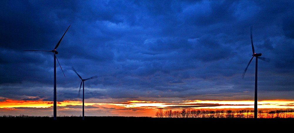 Wind turbines at sunset