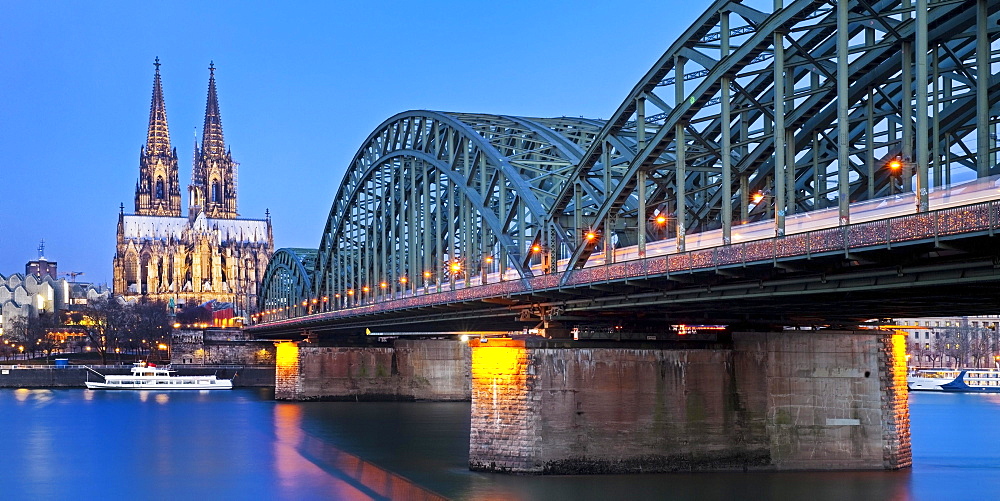 Cologne Cathedral with Hohenzollern Bridge at dusk, Cologne, North Rhine-Westphalia, Germany, Europe