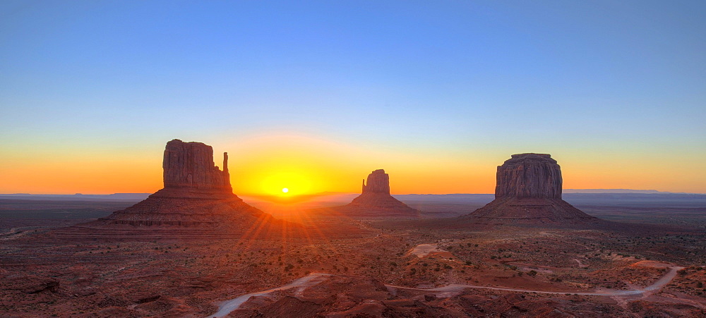 Panoramic view, sunrise at the mesas of West Mitten Butte, East Mitten Butte, Merrick Butte, Scenic Drive, Monument Valley, Navajo Tribal Park, Navajo Nation Reservation, Arizona, Utah, United States of America, USA