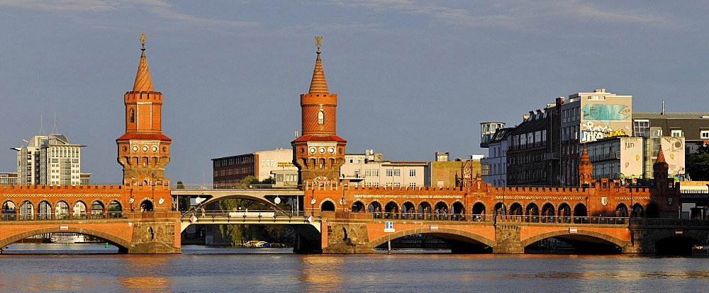 Oberbaumbruecke bridge crossing the Spree River in the evening light, Friedrichshain-Kreuzberg, Berlin, Germany, Europe