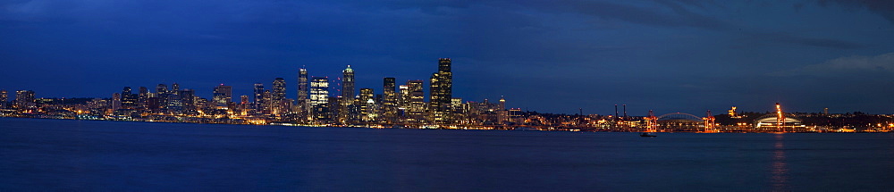 Views at night of downtown Seattle, Washington State, USA. Pacific Ocean.  No model or property releases are available for this image.