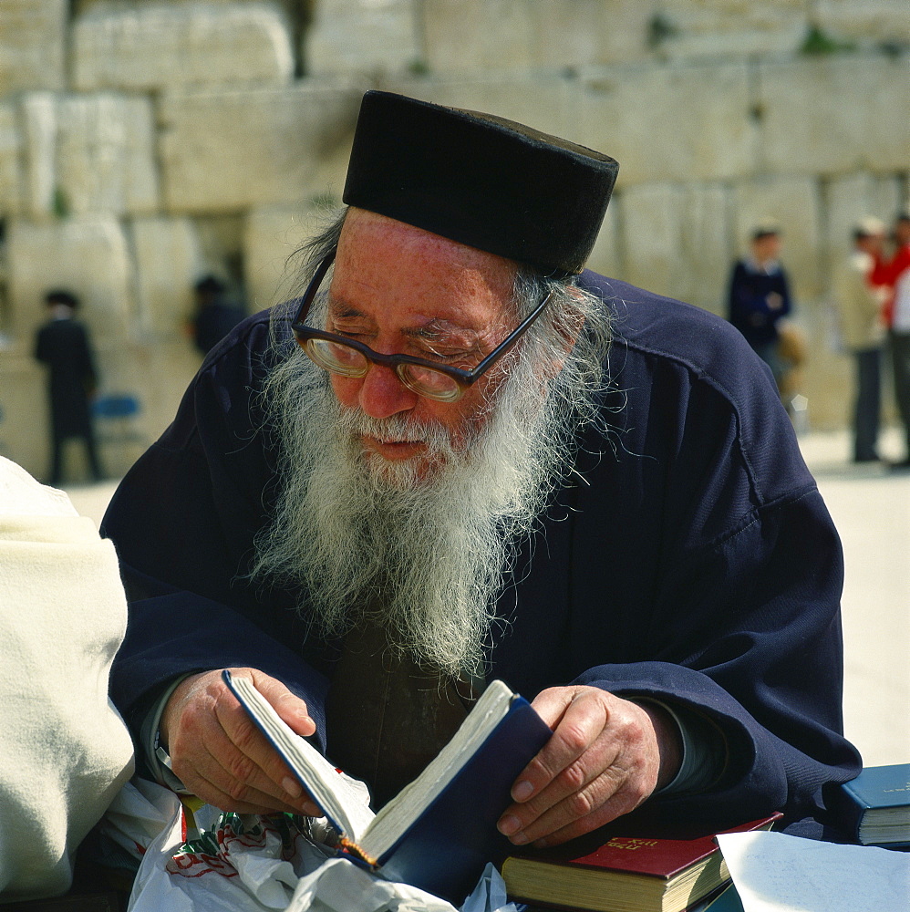 Old man with prayer book at the Western Wall, Jerusalem, Israel, Middle East