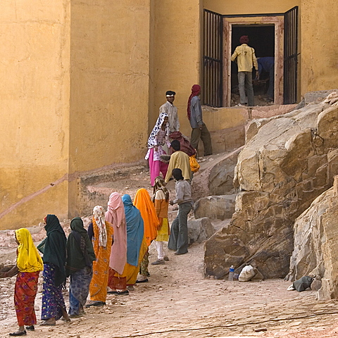 Men and women working on the restoration of the Amber Fort, Jaipur, Rajasthan, India.