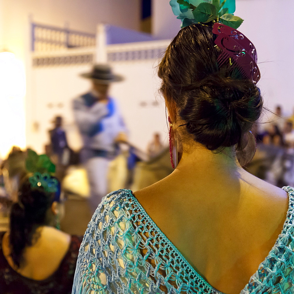 Spanish girl watching horse-back feria procession, Tarifa, Andalucia, Spain, Europe