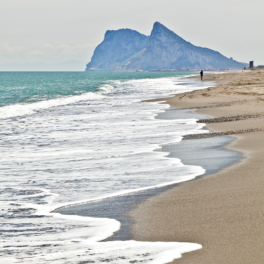 Tourist walking toward Gibraltar, Alcaidesa beach, near Sotogrande, Andalucia, Spain, Europe