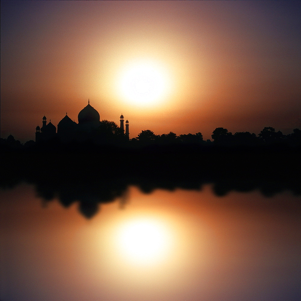 The Taj Mahal reflecting in the river at sunset, Agra, Uttar Pradesh, India, Asia