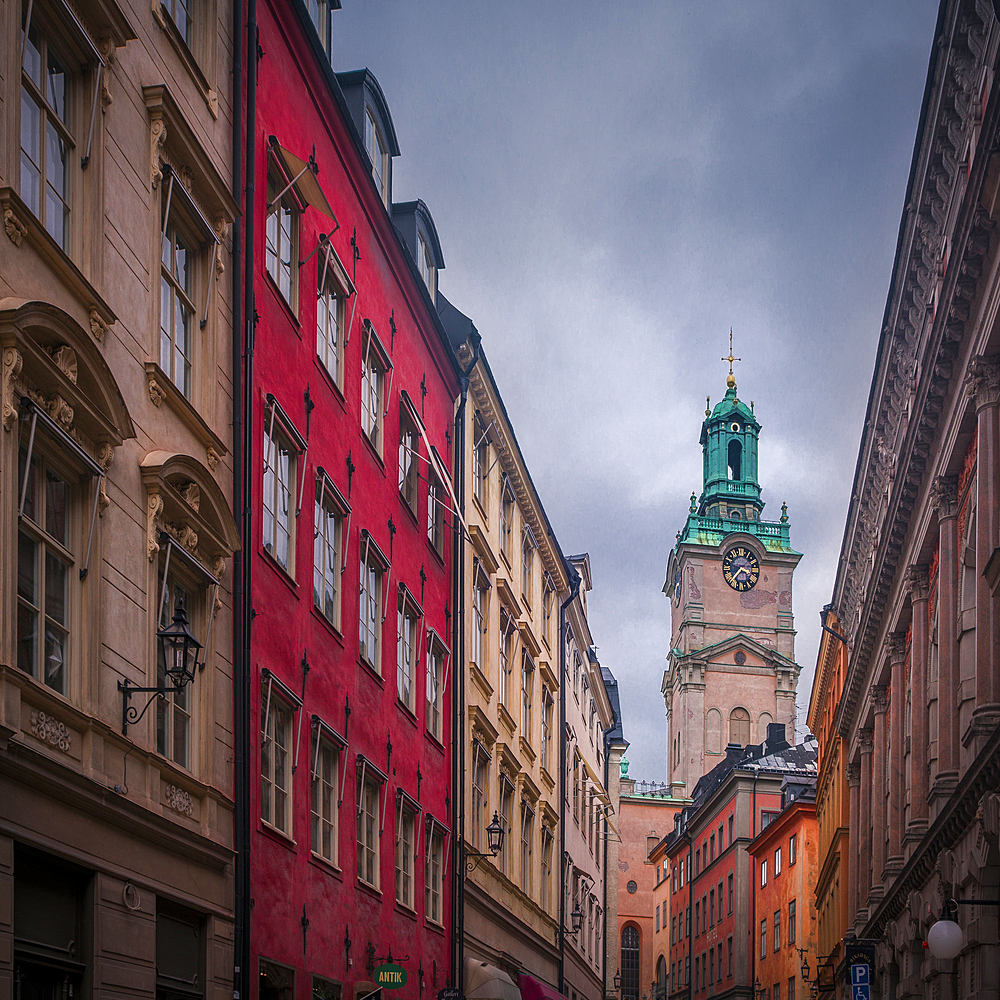 House facades with Tyska Kyrkan church in the old town Gamla Stan in Stockholm in Sweden