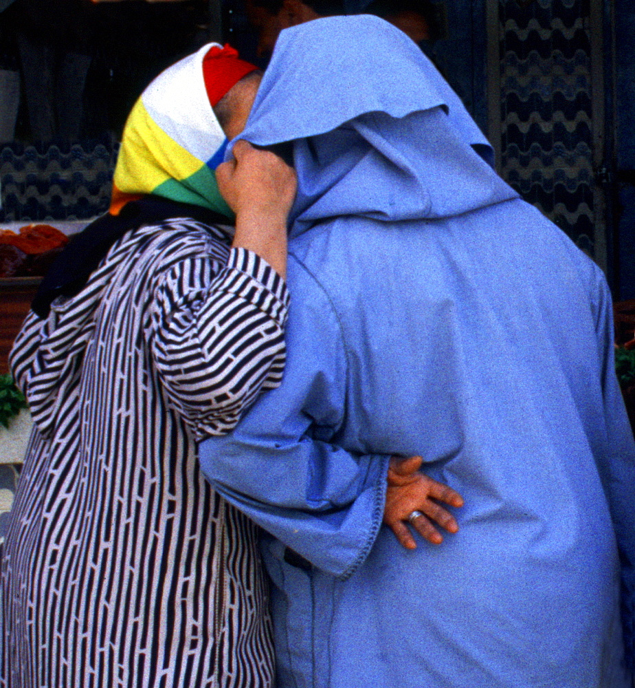 Two women talking to each other, Fes, Morocco, Africa