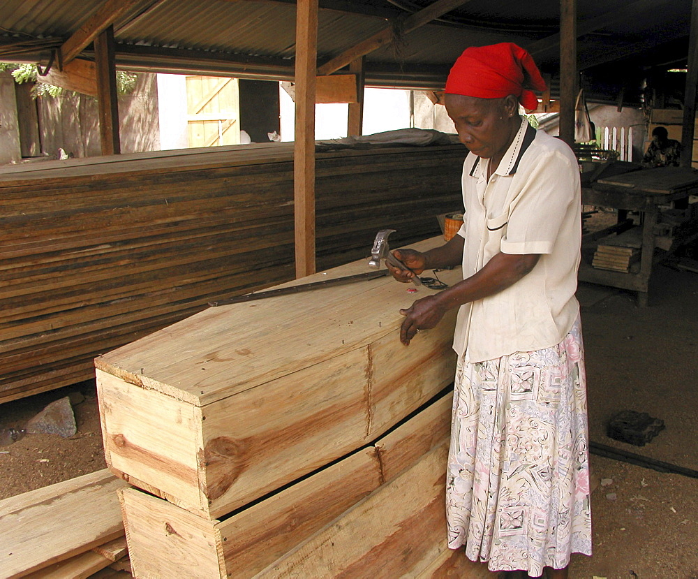 Woman making coffins, tanzania. Musoma