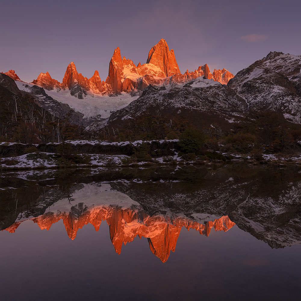 The mountain range with Cerro Fitz Roy at sunrise reflected in lake, Los Glaciares National Park, UNESCO World Heritage Site, El Chalten, Santa Cruz Province, Patagonia, Argentina, South America