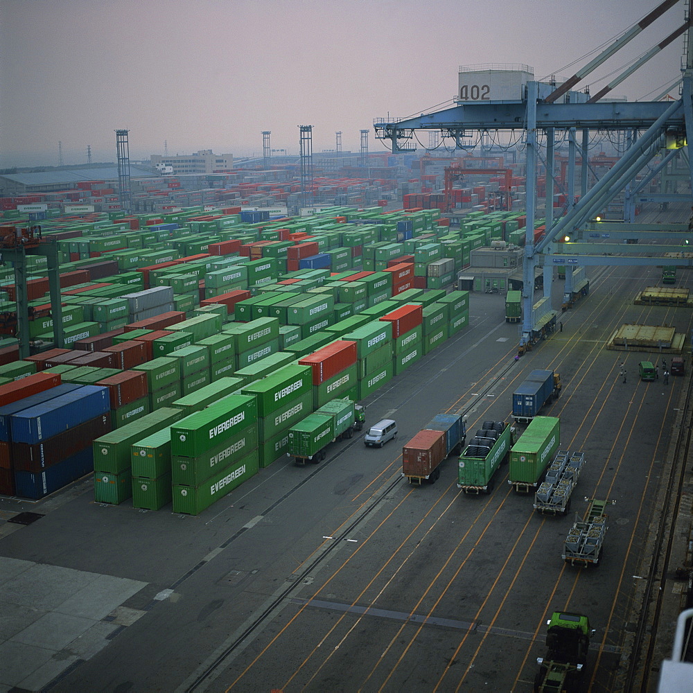 Aerial of Evergreen containers and cranes in a terminal in Taiwan, Asia