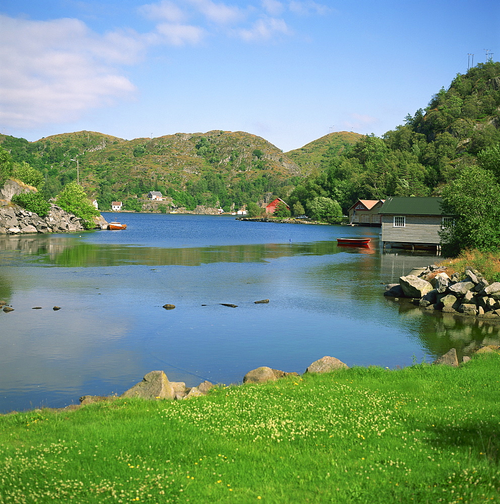 Small wooden houses on an inlet, near Stavanger, west Norway, Scandinavia, Europe