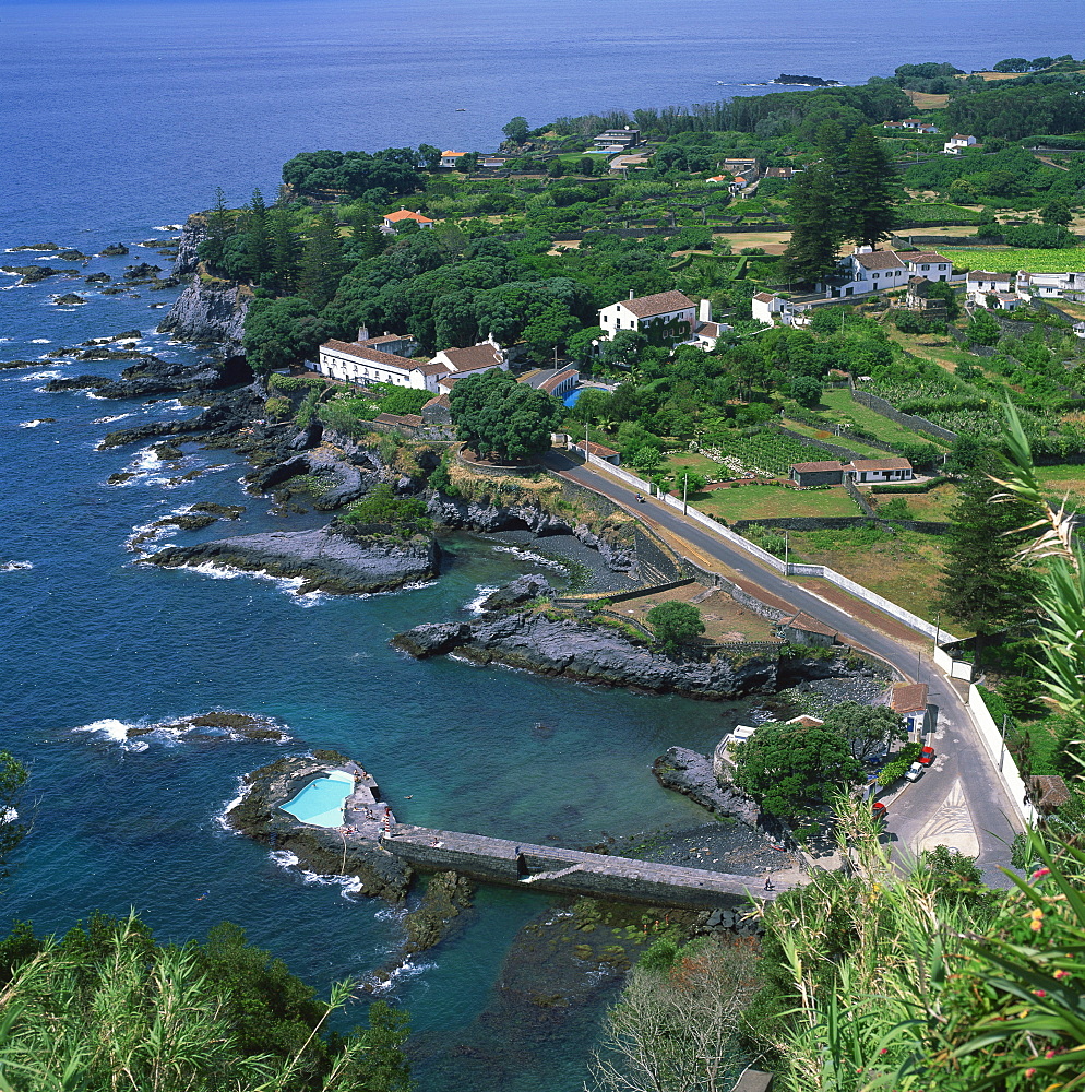 Houses and rocky coastline in the south of the island of Sao Miguel in the Azores, Portugal, Atlantic, Europe