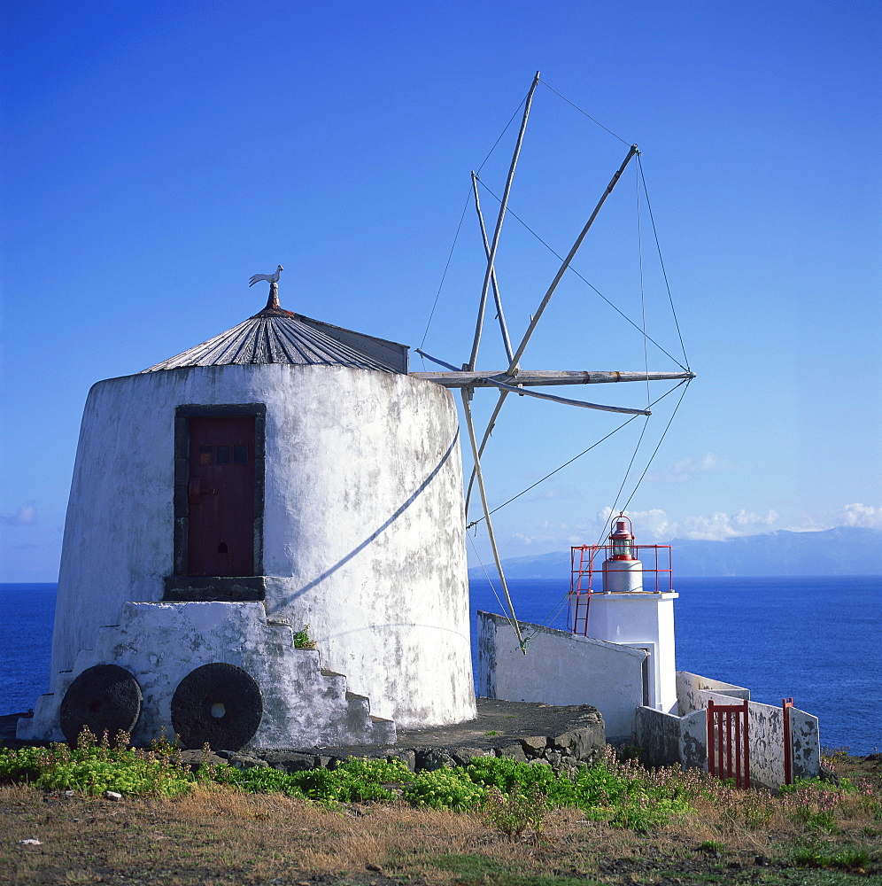 Windmill on Corvo with the island of Flores in the background, Azores, Portugal, Atlantic Ocean, Europe