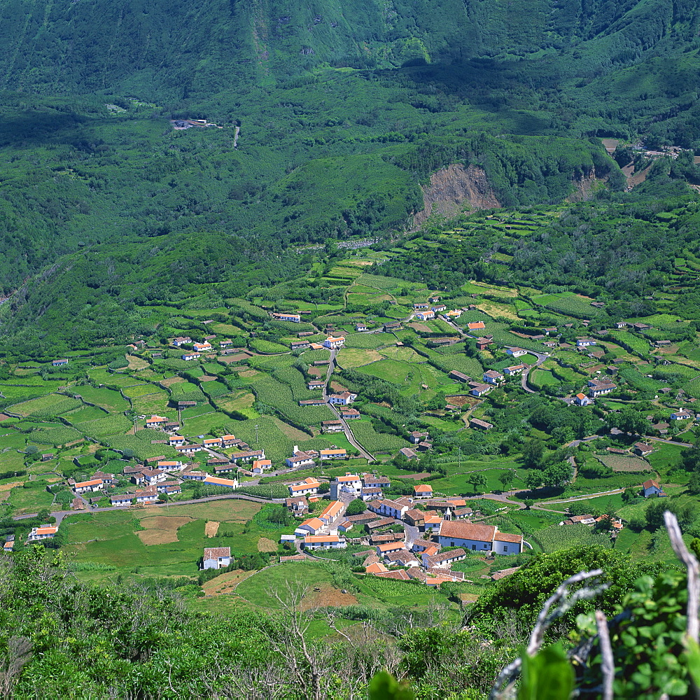 Low aerial landscape of houses and fields on the island of Flores in the Azores, Portugal, Atlantic, Europe