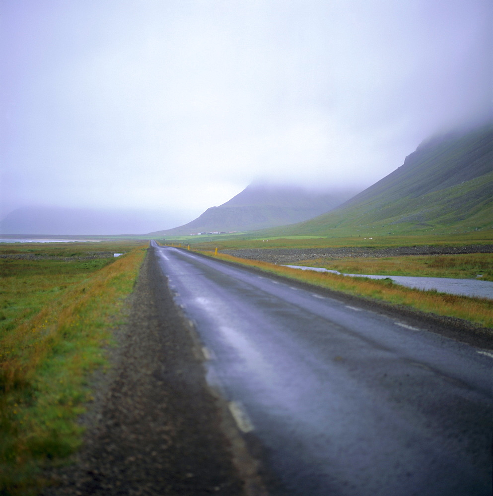 Empty road and low cloud near Patreksfjordur, west Iceland, Polar Regions