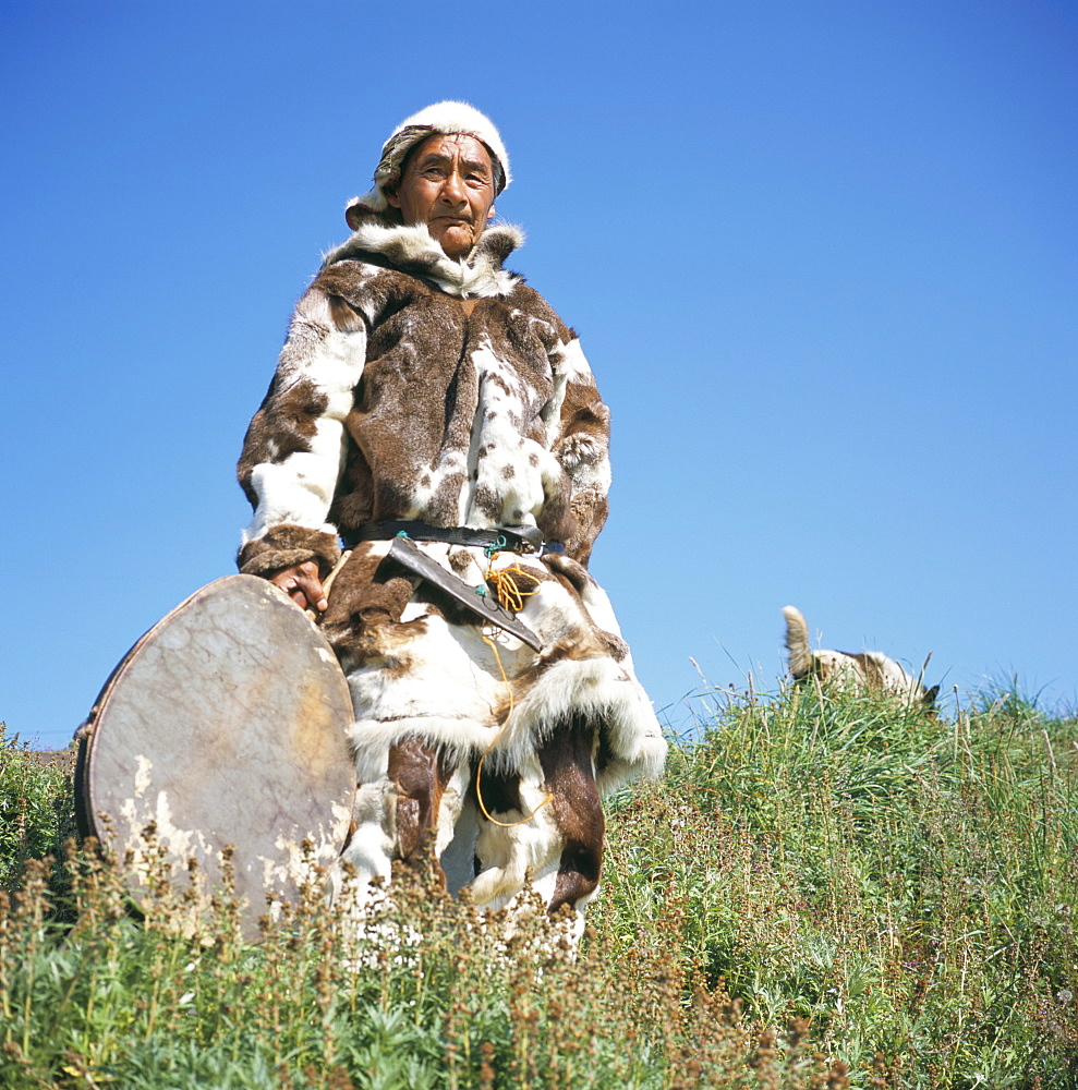 Eskimo in traditional clothing at Yanrakino village (population 150), Chukchi Peninsula, Russian Far East, Russia, Asia