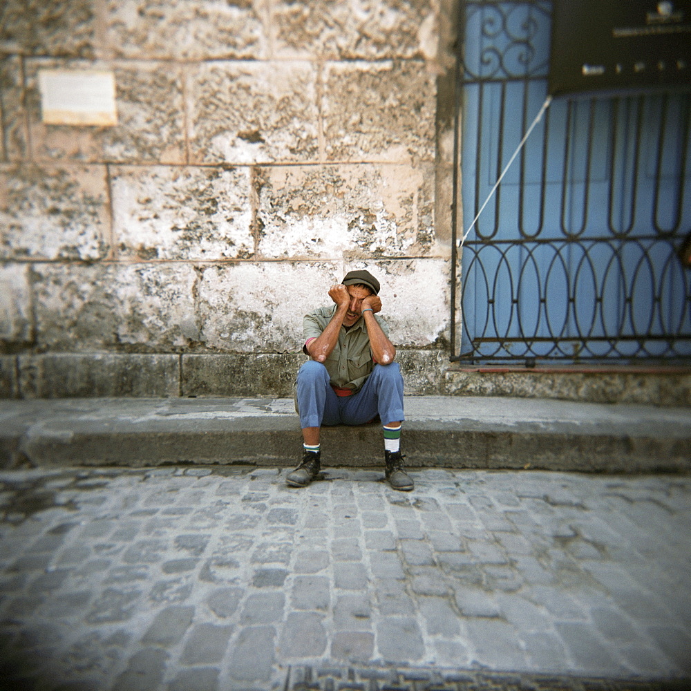 Man sleeping, Plaza Viejo, Havana, Cuba, West Indies, Central America