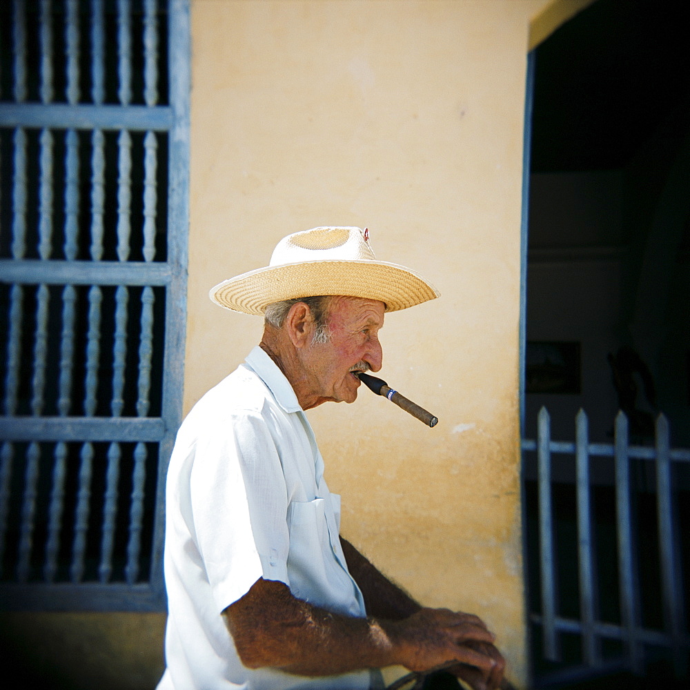 Old man in profile, smoking cigar, Trinidad, Cuba, West Indies, Central America