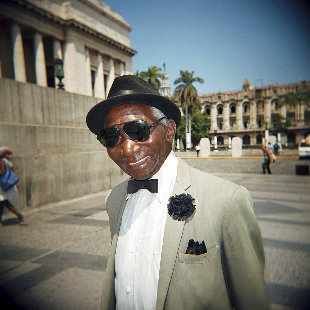 Portrait of a man in suit and shades, Havana, Cuba, West Indies, Central America