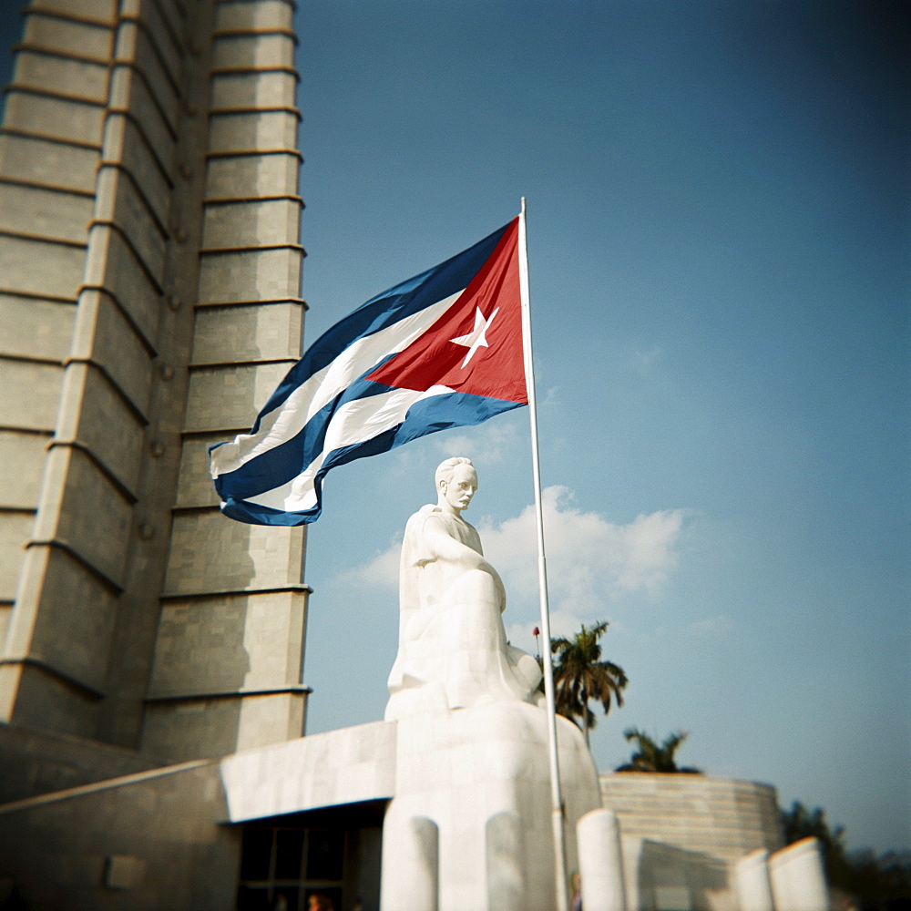 Cuban flag and Jose Marti memorial, Plaza de la Revolucion, Havana, Cuba, West Indies, Central America