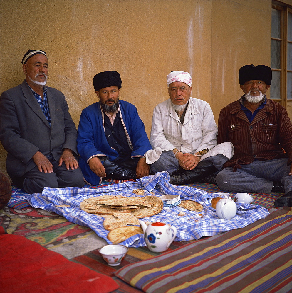 Uzbek imam and Muslims in a mosque, Khiva, Uzbekistan, Central Asia, Asia