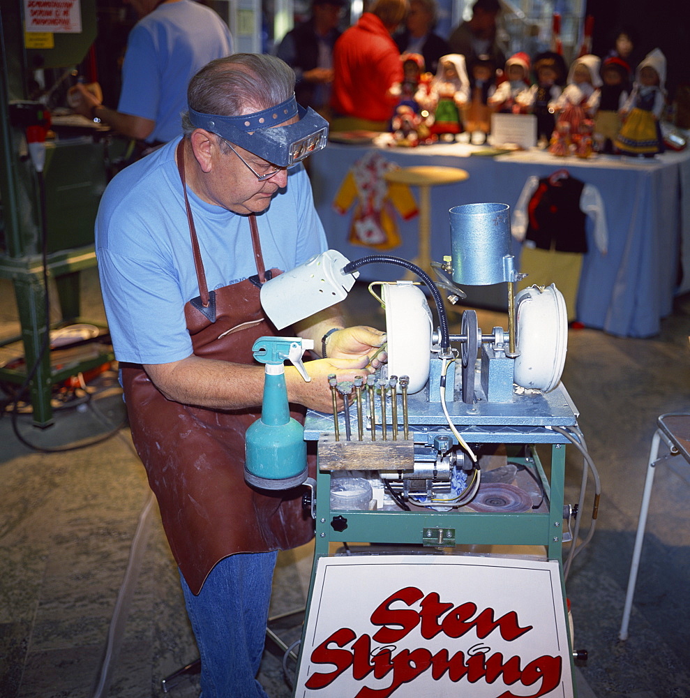 Man polishing semi-precious stones, Gallerian shopping mall, Stockholm, Sweden, Scandinavia, Europe