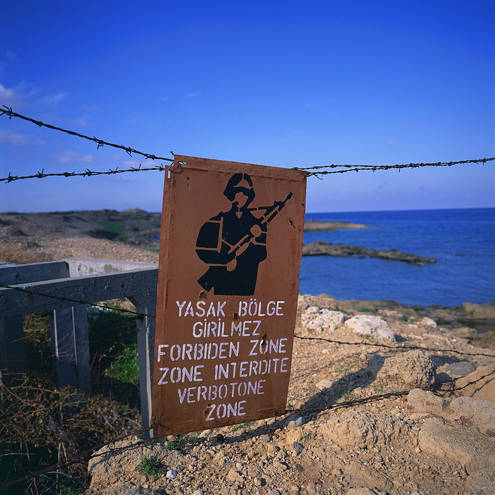 Barbed wire and forbidden zone sign of Turkish Military zone, common following 20 July 1974 invasion, near Lapta, Lambousa, North Cyprus, Europe