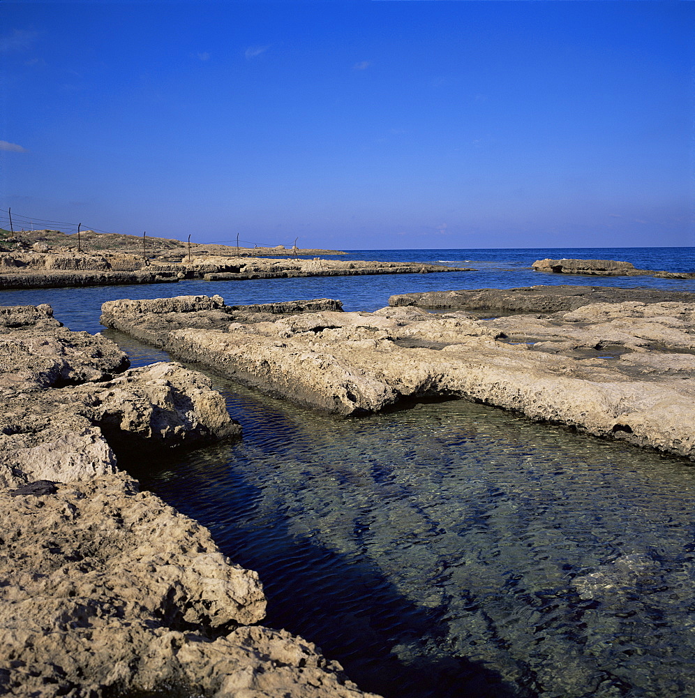 Rectangular tanks cut into rock by Romans to keep fish catch fresh for market, Lambousa, near Lapta, North Cyprus, Cyprus, Europe