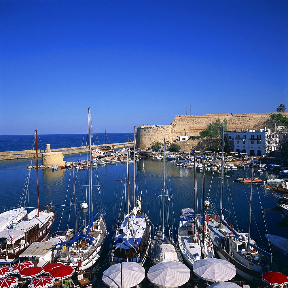 Boats in harbour and Kyrenia castle built by Lusignans between 1192 and 1211 and reconstructed by Venetians around 1550, Kyrenia, North Cyprus, Europe