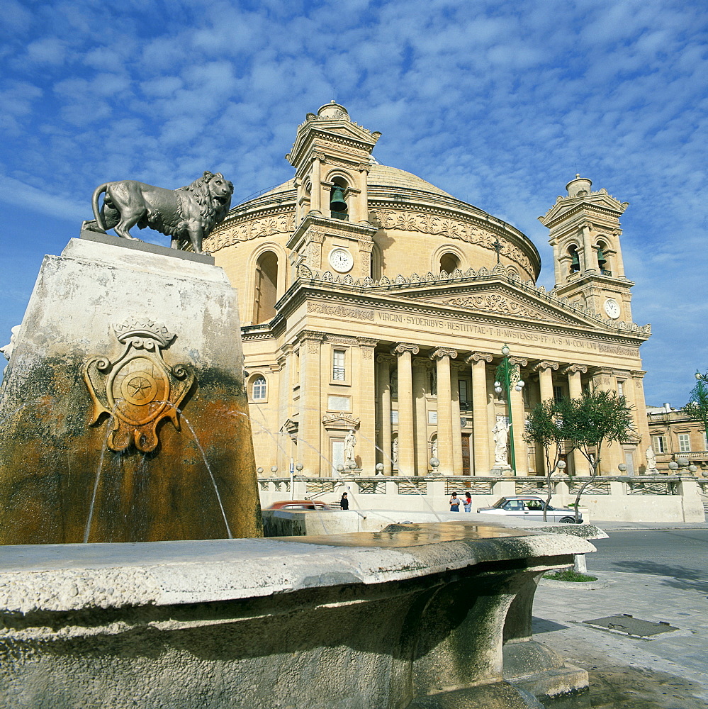 Lion on a fountain in front of the Rotunda church at Mosta, Malta, Europe