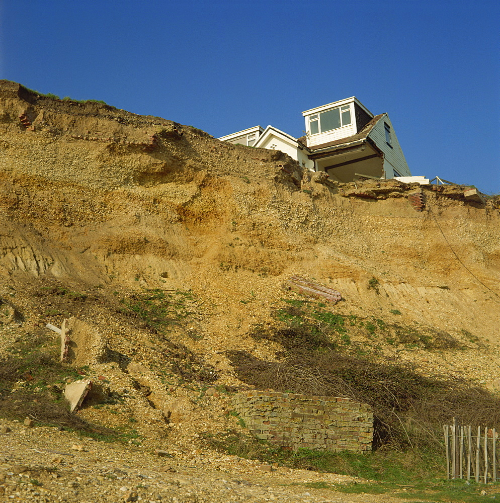 House about to topple over cliffs, Barton-on-Sea, Hampshire, England, United Kingdom, Europe