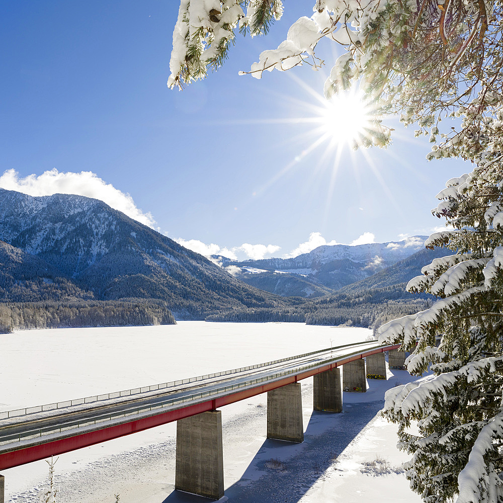 The Faller-Klamm Bridge. Frozen Sylvenstein Reservoir near Bad Toelz in the Isar valley of Karwendel Mountain Range during winter. Germany, Bavaria, Bad Toelz