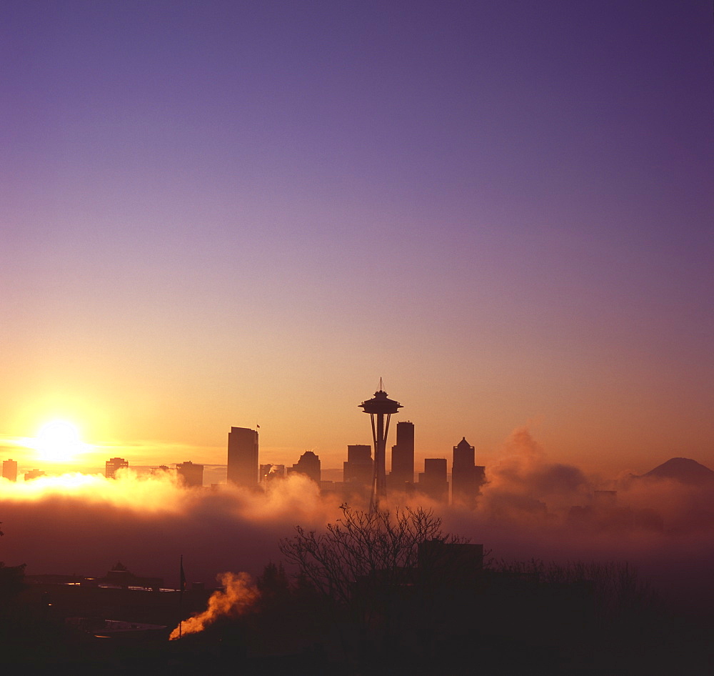 Sunrise over silhouette of Seattle skyline and Mt. Rainier, Seattle, Washington, United States of America, North America