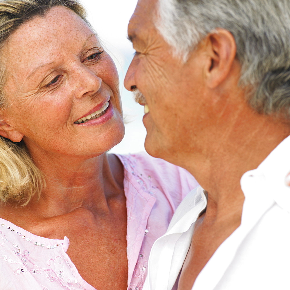 senior couple on beach, close-up