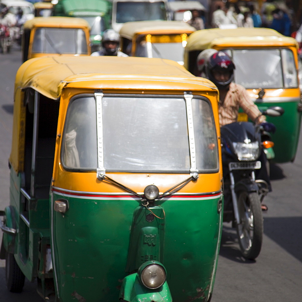 Busy road with Tuk-tuk auto rickshaws, Chandni Chowk, Old Delhi, India, Asia