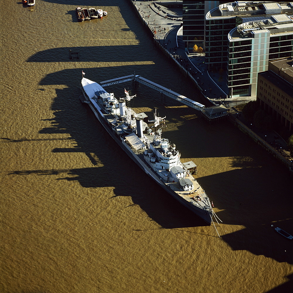 Aerial image of HMS Belfast, a Royal Navy Town-class cruiser, on the River Thames, London, England, United Kingdom, Europe