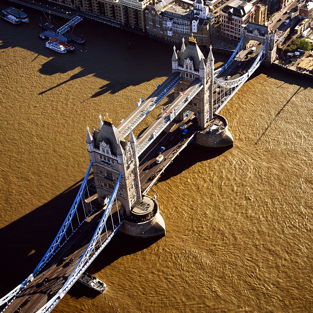 Aerial image of Tower Bridge, a combined bascule and suspension bridge, over the River Thames, London, England, United Kingdom, Europe