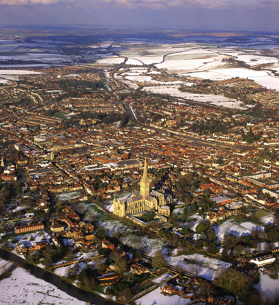 Aerial image of Salisbury Cathedral and city in snow, Salisbury, Wiltshire, England, United Kingdom, Europe